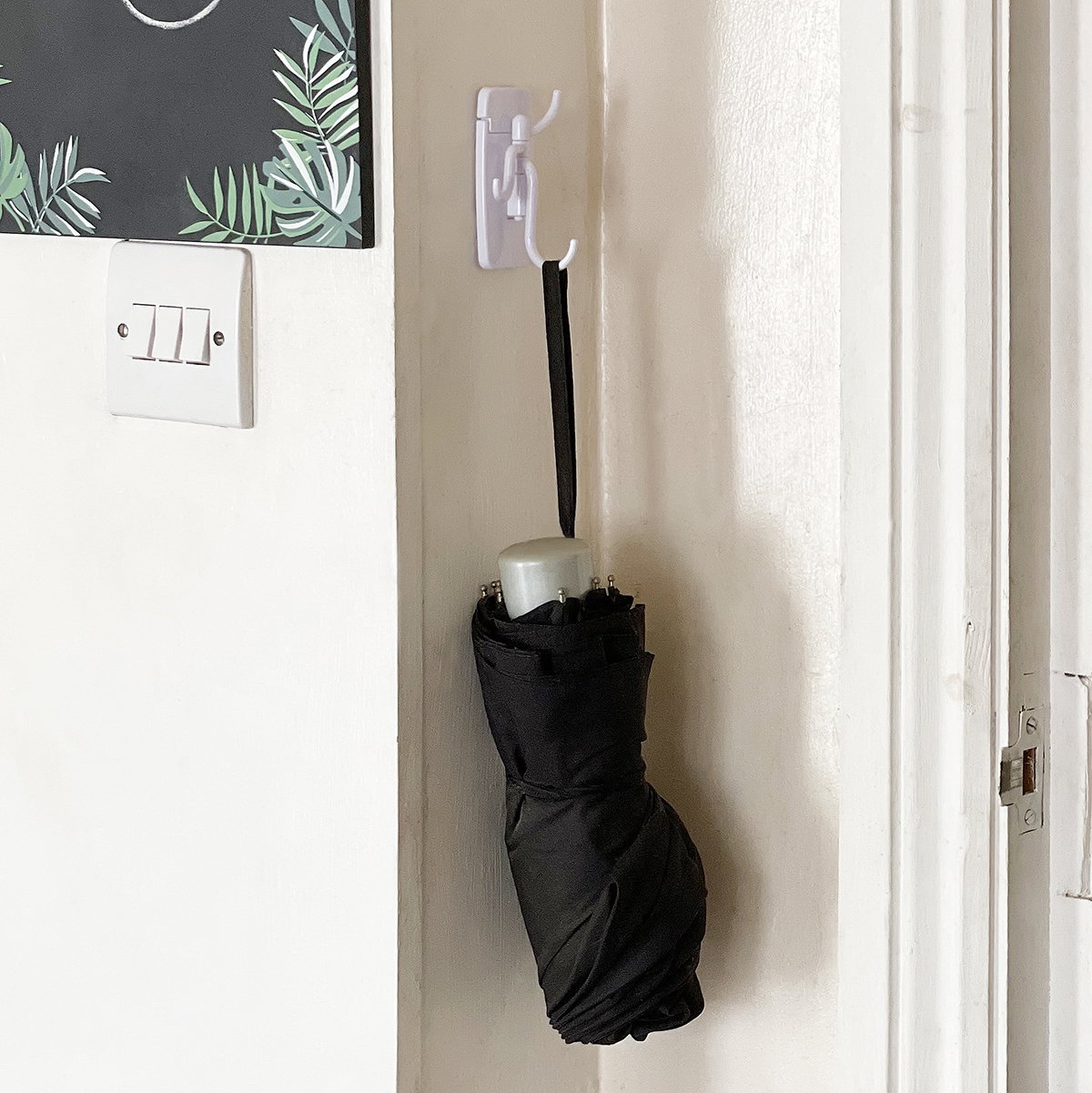 Self-adhesive hanging hook with swivel arms